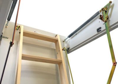 Spring counter balance makes opening and closing the wooden loft ladder easier